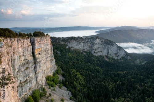 Quadro em tela Cliff Creux du Van Neuchatel in warm sunset light with sceenic view on valley, g