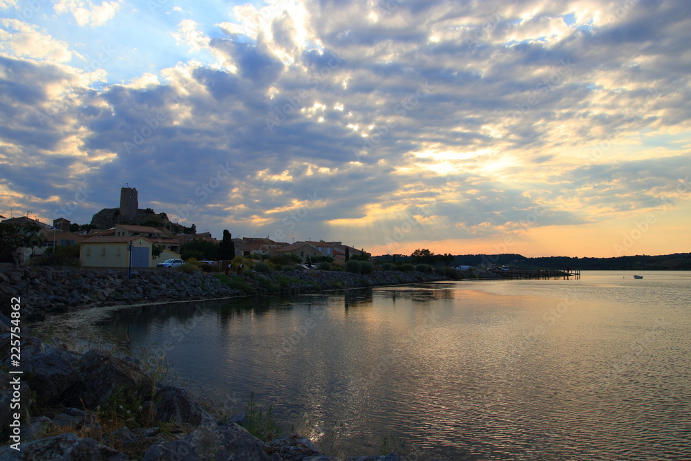 mediterranean village of Guissan and marine pond at sunset  , Aude in the south of France

