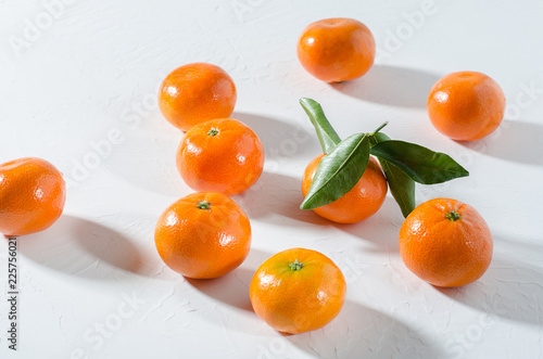 Fresh tangerines on white background.