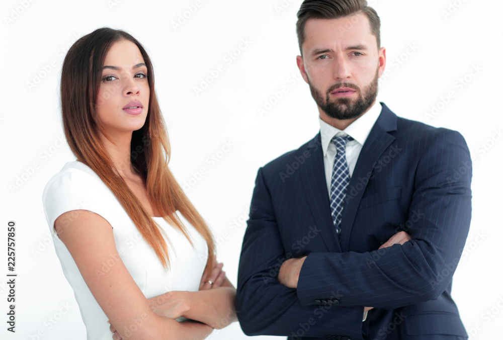 A business man and woman with their hands crossed