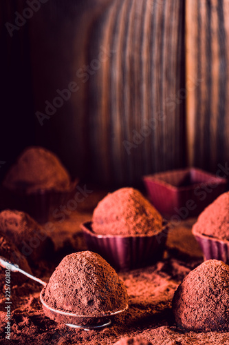 фотографія Chocolate truffles on wood, macro