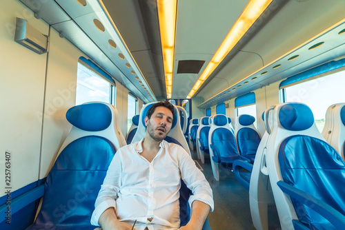 tired man sleeping in the train