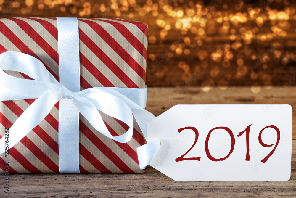 Fototapeta premium Atmospheric Red Christmas Gift With Label, Text 2019