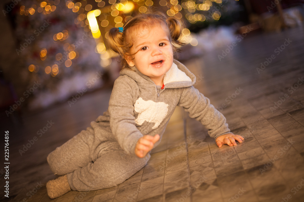 beautiful baby on christmas decorated room