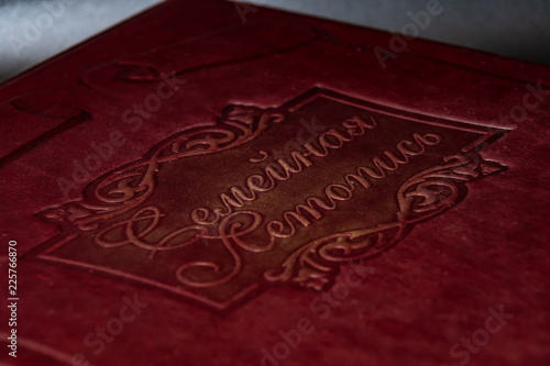 Leather book cover with gold insert close-up