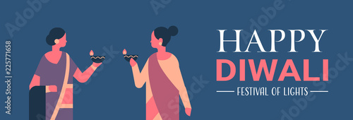 Happy Diwali Indian women holding oil lamp