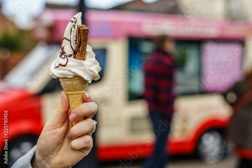 99 flek ice cream on hand in front of ice cream van 