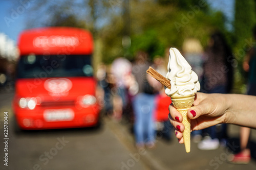 99 flek ice cream on hand in front of ice cream van  photo