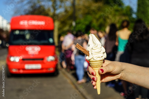 99 flek ice cream on hand in front of ice cream van 