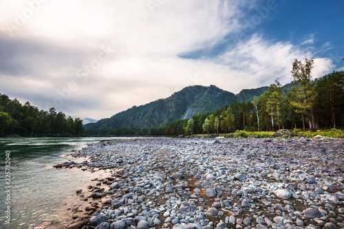 Rounded stones on the coast of the Katun river. Mountain Altai, Southern Siberia, Russia photo