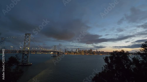 Wallpaper Mural San Francisco Bay Bridge And Evening Skyline on a cloudy day. Torontodigital.ca