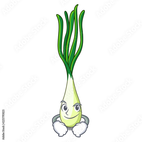 Smirking cartoon fresh green onions on cutting board