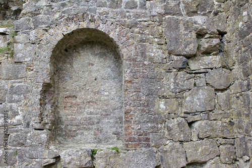 Bricked in arched window of a medieval castle ruin in County Laois, Ireland (Rock of Dunamase) photo