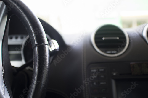 Interior of premium sedan car. steering wheel and dashboard of the car