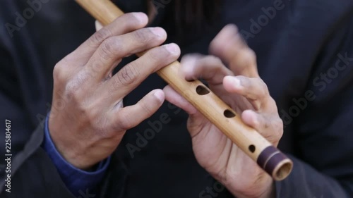 musician playing flute in indian wedding.