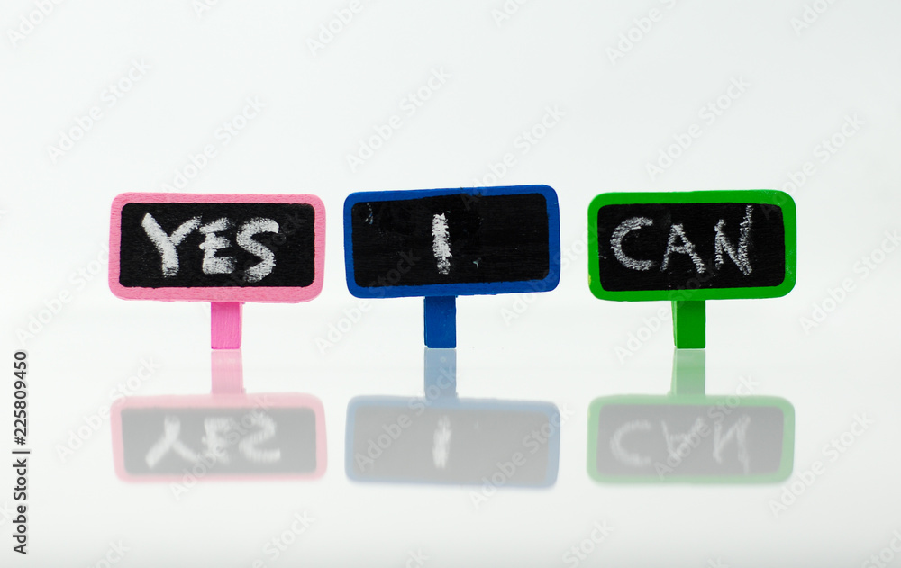 Chalkboard with text yes i can on white background. Motivational concept.