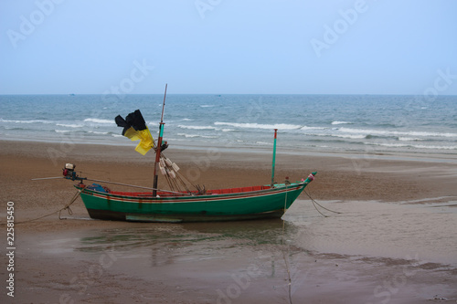 Thai fishing boat on beach photo