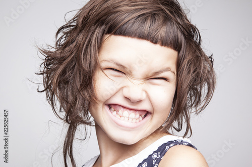 Portrait of a girl with a stylish hairstyle with a short bangs and nice smile