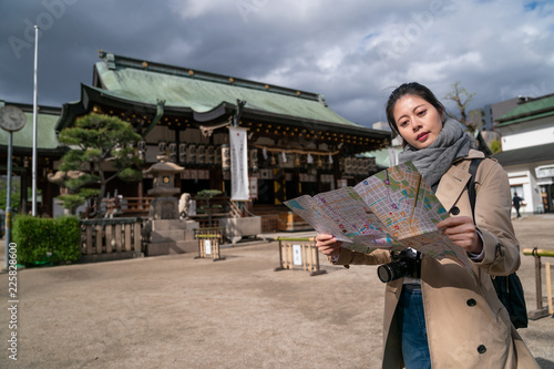 tourist is checking the route on the map photo