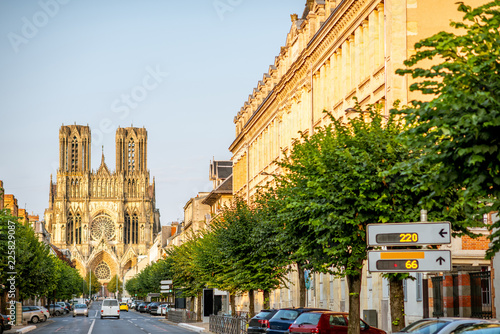 Street view with cathedral in Reims city, France photo