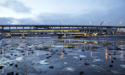 Moskva River, Luzhnetskaya Bridge (Metro Bridge) on a winter evening. Moscow, Russia. Metro station Vorobyovy Gory  -- inscription in Russian photo