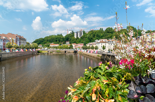 Flowers on a bridge across the Moselle River in Epinal, France