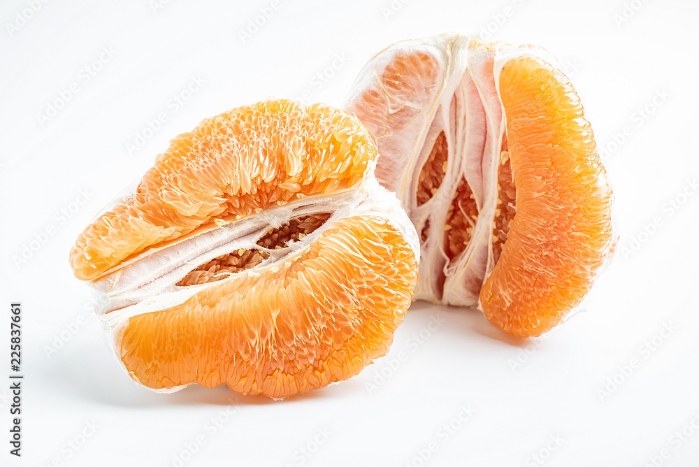 Golden grapefruit flesh on white background Golden grapefruit flesh on white background