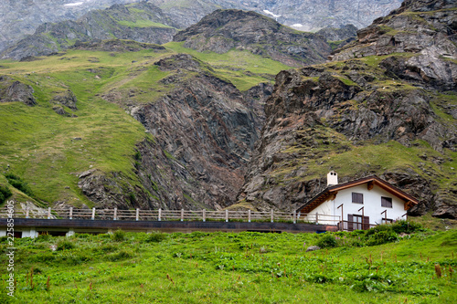 Alpine landscape with htipical house in Aosta Valley, Italy