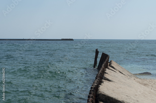 Old dilapidated pier - the sights of the Crimean peninsula photo