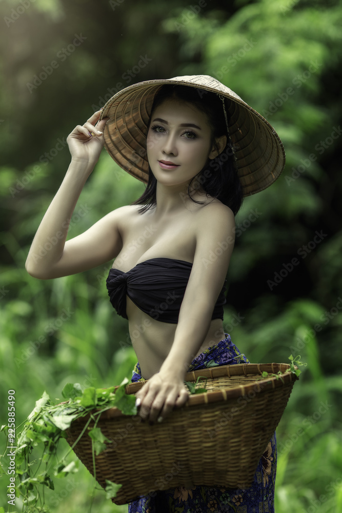 Asian Thai women beautiful sexy in the garden with glazed in basketbasket  Stock Photo | Adobe Stock