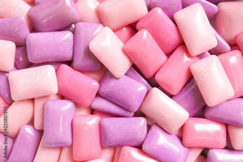 gum. colorful confectionary background of candy gums in different shades of pink and purple. photo