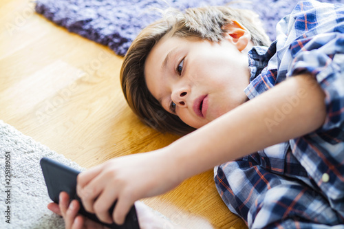 Teen boy using mobile phone