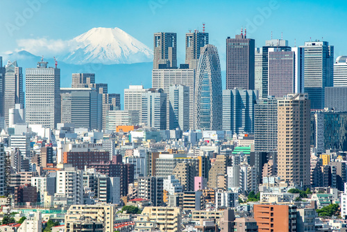 Tokyo, Shinjuku building cityscape and Mt. Fuji at Behind.