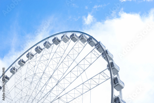 Ferris wheel against the bright blue sky