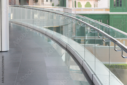 Quadro em tela tempered glass of walk way balcony with stainless steel handrail.