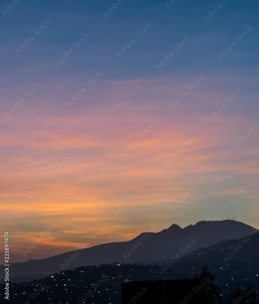 Colorful sunrise over mountain silhouettes