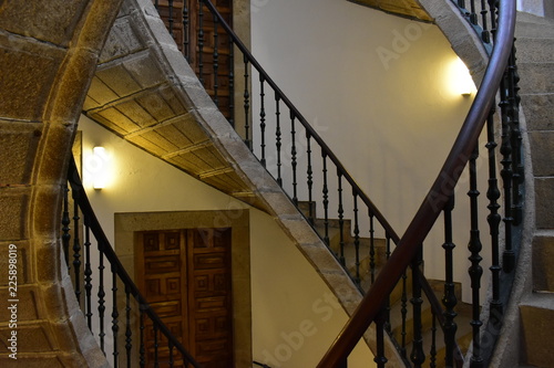 Triple helical stone staircase. San Domingo de Bonaval, Santiago de Compostela, Spain. photo