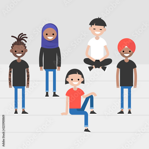 A group of young adults sitting and standing on the stairs