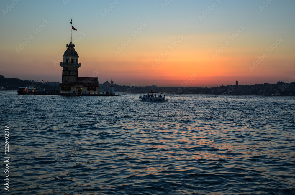 Historical town istanbul silhouette and Maiden's Tower in the  sunset.