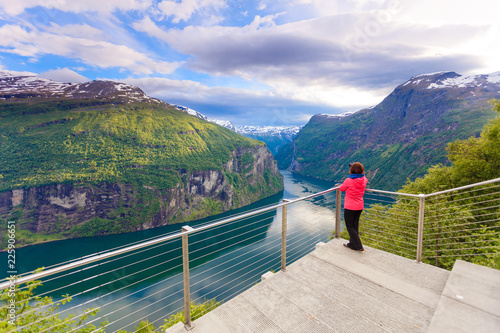 Tourist taking photo from Flydasjuvet viewpoint Norway photo