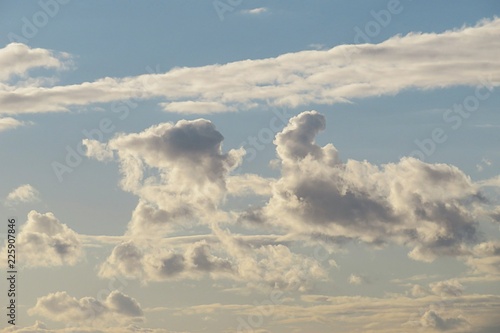 Beautiful white gray clouds in blue sky, natural background photo