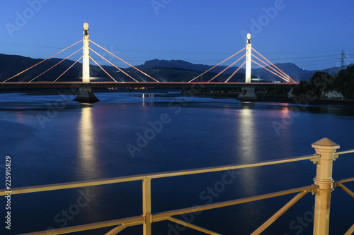 Night panoramic of the suspension bridge over the river Asón photo