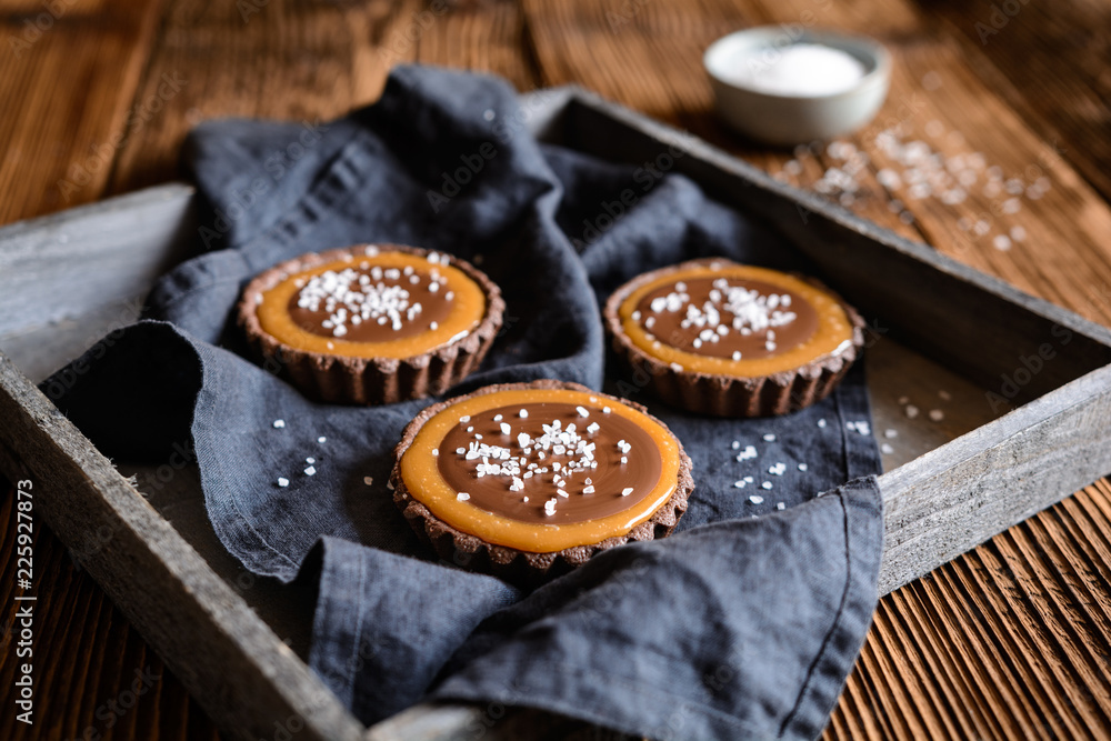 Chocolate caramel tartlets studded with salt