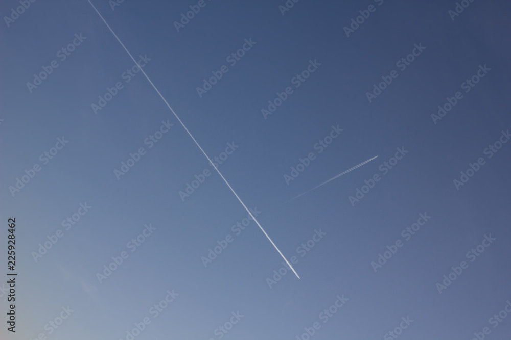 Plane flying on a blue sky, condensation line. Plane flying on a blue sky, condensation line.