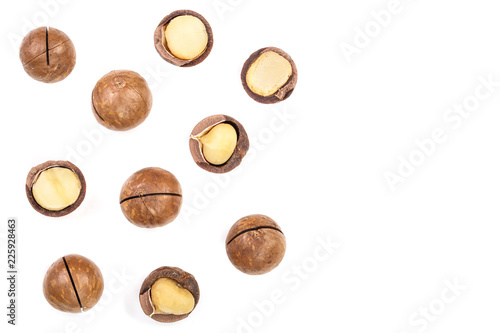 Shelled and unshelled macadamia nuts isolated on white background with copy space for your text. Top view. Flat lay pattern