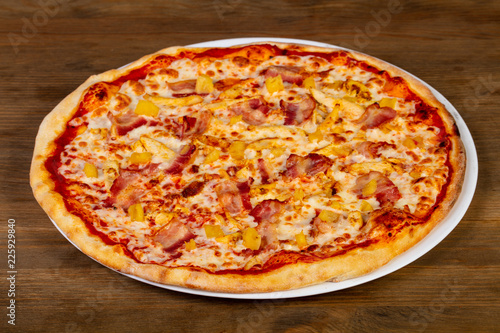 Pizza with bacon and pineapple