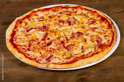 Pizza with bacon and pineapple