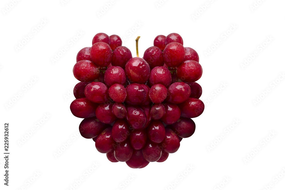 Fresh red grapes in the form of heart isolated on white background Fresh red grapes in the form of heart isolated on white background