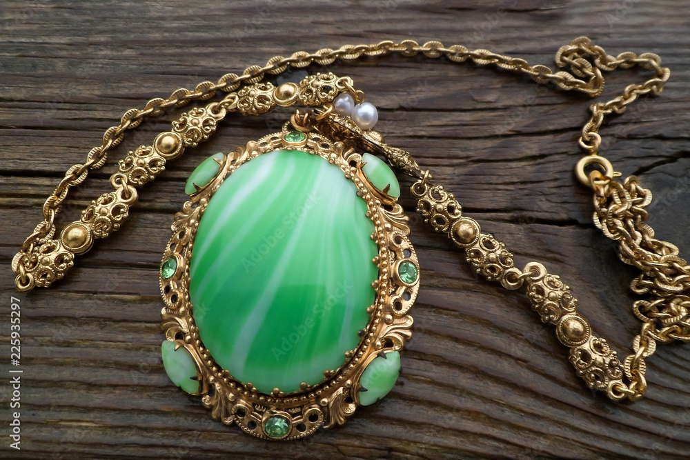 Fototapeta premium Old German pendant on a chain of the 50s, 60s. Vintage jewelry. Bijouterie.