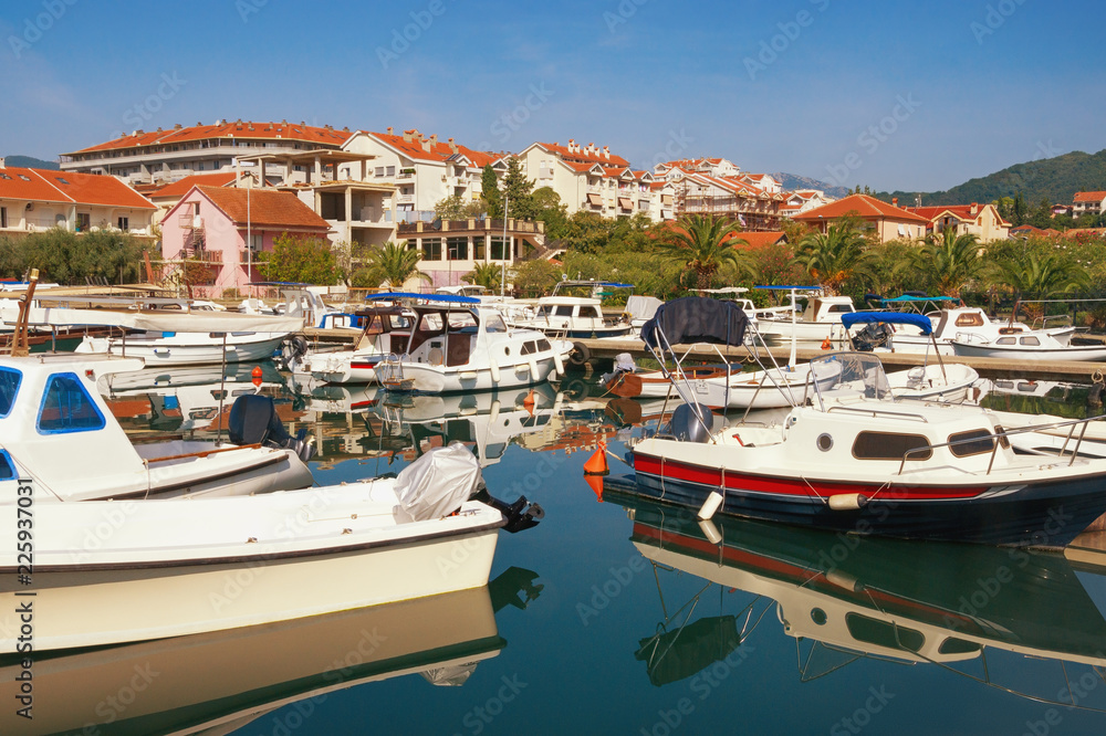 Picturesque landscape of Mediterranean town with a harbor for fishing boats. Montenegro, Tivat city, view of Marina Kalimanj